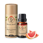 Confezione e bottiglia da 8 ml di olio essenziale di Pompelmo Aroma Bano con spicchi di pompelmo fresco