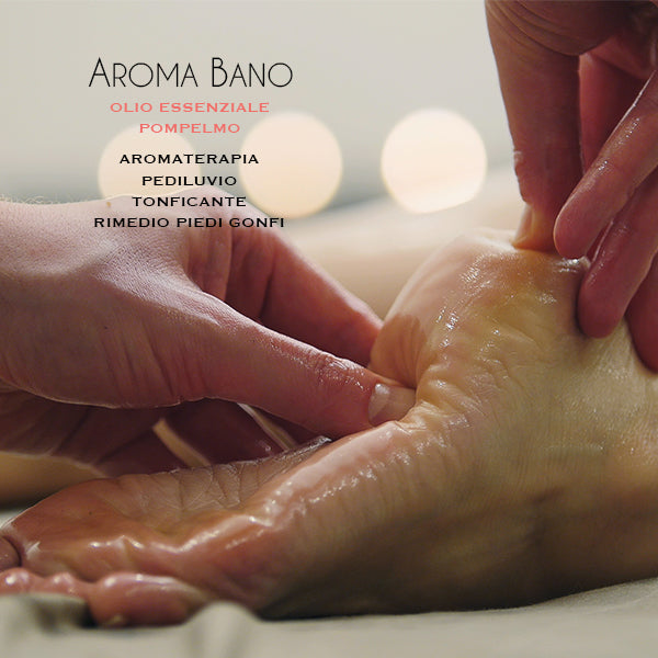 Massaggio ai piedi con olio essenziale di Pompelmo Aroma Bano in formato 8 ml, utilizzato per pediluvio e trattamento rilassante