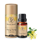 Confezione e bottiglia da 8 ml di olio essenziale di Ylang Ylang Aroma Bano con fiore di ylang ylang